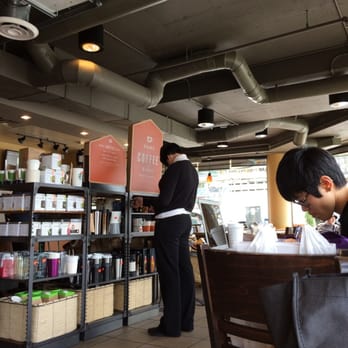 Starbucks - a man and a woman in a coffee shop - Coffee & Tea Near Me - Vancouver, British Columbia Starbucks - a man and a woman in a coffee shop - Coffee & Tea Near Me - Vancouver, British Columbia