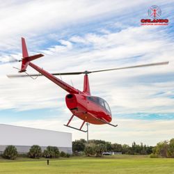 Orlando Helicopter Adventures - A sleek, modern red helicopter sits ready for takeoff at our Orlando departure lounge, promising the thrill of a lifetime...