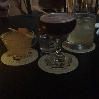 Knee High Stocking - (left to right) Hard Days Night, Tangrine, Smoky the Pear - Cocktail Bars Near Me - Seattle, Washington Knee High Stocking - (left to right) Hard Days Night, Tangrine, Smoky the Pear - Cocktail Bars Near Me - Seattle, Washington