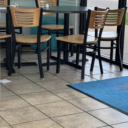TCBY Wolf Chase - Dirty tables/chairs and chocolate smeared on the floor.