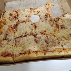 Caputos Friendly Inn - 16" square pizza with a few pieces missing