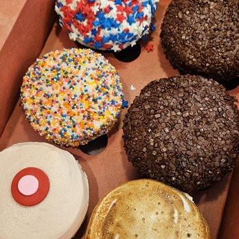 Sprinkles Newport Beach - Clockwise (forgot the exact names): 4th of July holiday flavor, dark chocolate x2, s'mores, strawberry, birthday/funfetti - Bakeries Near Me - Newport Beach, California Sprinkles Newport Beach - Clockwise (forgot the exact names): 4th of July holiday flavor, dark chocolate x2, s'mores, strawberry, birthday/funfetti - Bakeries Near Me - Newport Beach, California