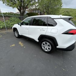Planet Cars - white SUV car in asphalt parking lot