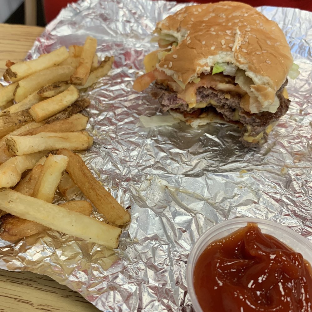 Five Guys - He just couldn't wait! Double bacon cheeseburger. - Burgers Near Me - Lexington, Kentucky Five Guys - He just couldn't wait! Double bacon cheeseburger. - Burgers Near Me - Lexington, Kentucky