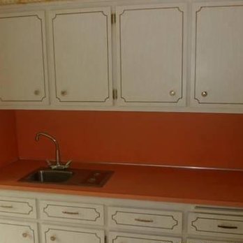 Precision Seven Construction - a kitchen with white cabinets and an orange countertop - General Contractors Near Me - Gahanna, Ohio Precision Seven Construction - a kitchen with white cabinets and an orange countertop - General Contractors Near Me - Gahanna, Ohio