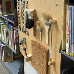 Betty Rodriguez Regional Library - Play area in the children's section: activity board