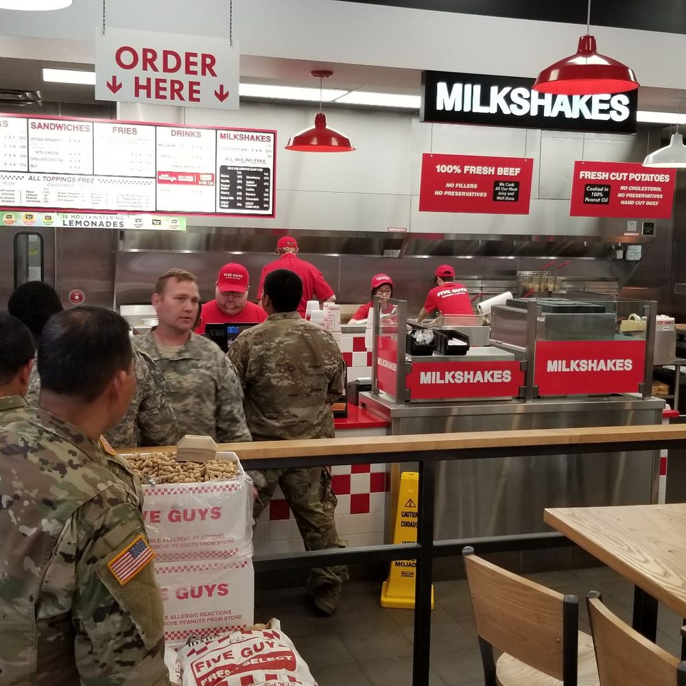 a group of soldiers in a fast food restaurant a group of soldiers in a fast food restaurant