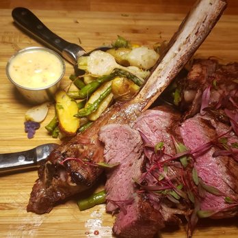 The Mill Steakhouse + Spirits - Tomahawk steak. Never had it cut before it arrived at our table before. Get the truffle sauce. - Sports Bars Near Me - Milton, Washington The Mill Steakhouse + Spirits - Tomahawk steak. Never had it cut before it arrived at our table before. Get the truffle sauce. - Sports Bars Near Me - Milton, Washington