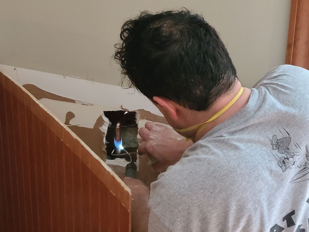 Slide of At Your Disposal Plumbing