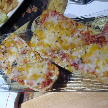Play by Play Restaurant - a plate of pizza and french fries - American Near Me - New York, New York Play by Play Restaurant - a plate of pizza and french fries - American Near Me - New York, New York