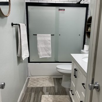 San Tan Remodeling - a bathroom with a glass shower door - General Contractors Near Me San Tan Remodeling - a bathroom with a glass shower door - General Contractors Near Me