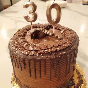 Vons - We ordered a custom round cake online & added our own edible glitter flakes & candles - Grocery Near Me - Santee, California