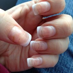 All-American Nails Etc - About a week after a fill. You can see every single fill I'd had, the air pockets and the nail damage to the nails.