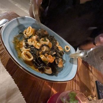 Cosima - Fettuccine AI Frutti di Mare. This is house made squid ink fettuccine with calamari, shrimp, and bae scallops. My partner loved it! - Italian Near Me - Baltimore, Maryland