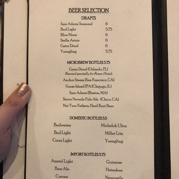 Headwaters Lounge - a hand holding a menu - Lounges Near Me - Orlando, Florida Headwaters Lounge - a hand holding a menu - Lounges Near Me - Orlando, Florida
