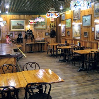Wall Drug Store - Another cafe and unused bar in back (not open, but accessible to everyone) with more artwork and stained glass lighting - Drugstores Near Me - Wall, South Dakota