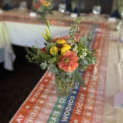 Forget Me Not Flower Market - Colorful floral arrangement and vases.