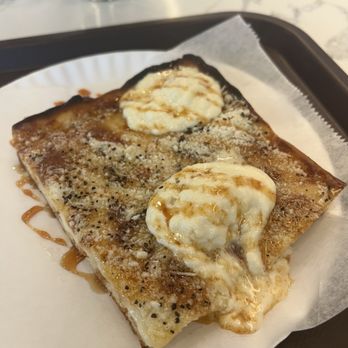 Joe & John's Pizzeria - CACIO E PEPE SLICE with hot honey - Pizza Near Me - Ridgewood, New York