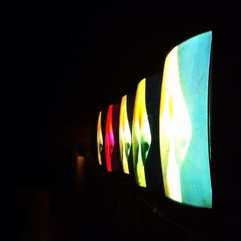 Dim Mak Studios - a row of televisions in a dark room - Dance Clubs Near Me - Los Angeles, California Dim Mak Studios - a row of televisions in a dark room - Dance Clubs Near Me - Los Angeles, California