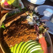 Photo of Plum Bistro - Seattle, WA, United States. Mama Africa salad with the Taco Night platter ("shrimp" and "chorizo" tacos with a side of Mac n Yease") on the left.