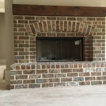 GG Brick Construction - a brick fireplace in a living room - General Contractors Near Me GG Brick Construction - a brick fireplace in a living room - General Contractors Near Me