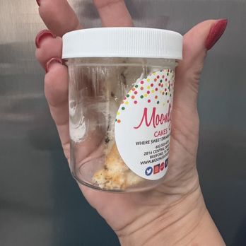 Moonlight Cakes - a hand holding a jar of doughnuts - Bakeries Near Me - Bedford, Texas