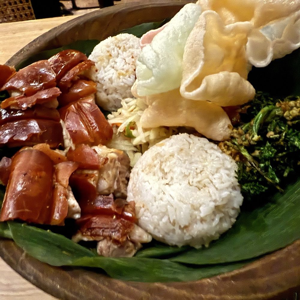 Naks - Lechon platter for two includes 2 servings of garlic rice, shrimp crackling crackers, broccolini, roast eggplant, and atchara. - Filipino Near Me - New York, New York Naks - Lechon platter for two includes 2 servings of garlic rice, shrimp crackling crackers, broccolini, roast eggplant, and atchara. - Filipino Near Me - New York, New York