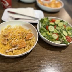 Noodles and Company - Creamy Cheddar Mac & Cheese Duo Grilled Chicken- 27 grams of protein, 150 calories Garden Salad