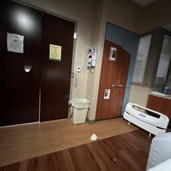 Atrium Health Carolinas Inpatient Rehabilitation - A typical patient room looking towards the door. The closet to the right has medical supplies in it.