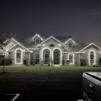 Sterling Landscaping - a house with christmas lights on the roof - Lawn Services Near Me Sterling Landscaping - a house with christmas lights on the roof - Lawn Services Near Me