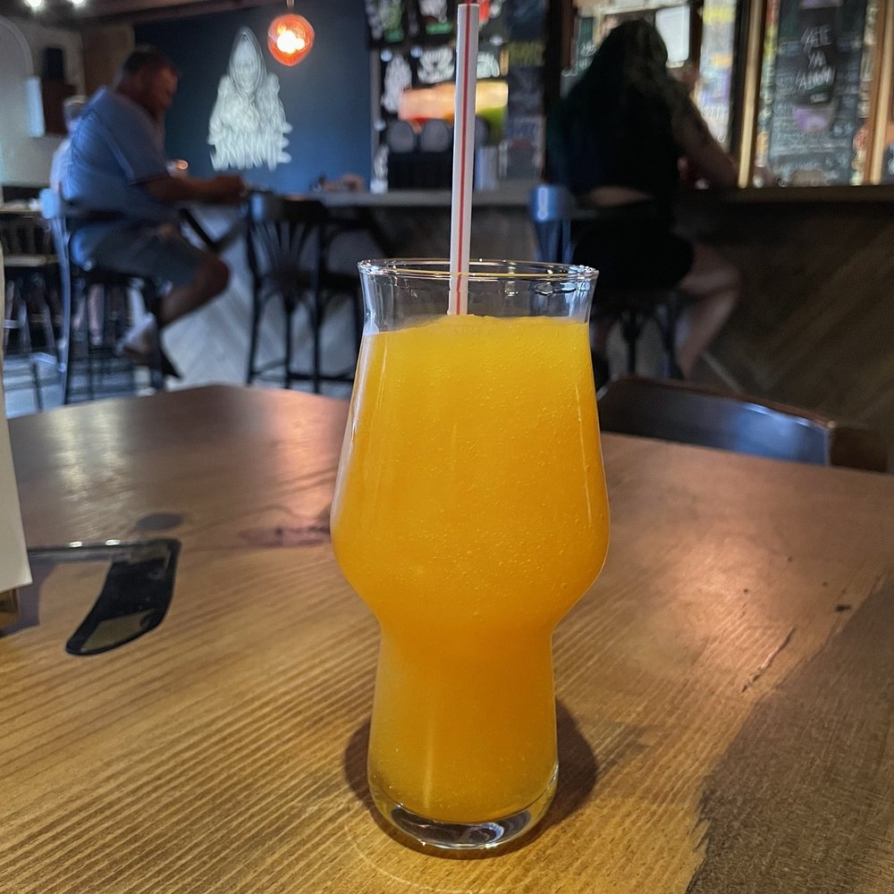 Jackknife Brewing - a glass of orange juice - Pizza Near Me - Kelowna, British Columbia Jackknife Brewing - a glass of orange juice - Pizza Near Me - Kelowna, British Columbia