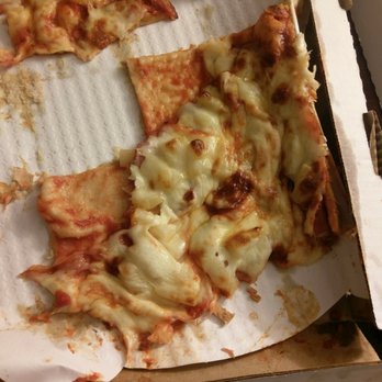 Lee's Pizza - a half eaten pizza in a box - Pizza Near Me - Duluth , Minnesota