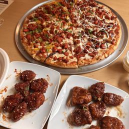 Honey Chili Wings, Mango Tamrind Wings, Butter Chicken Pizza, Tandoori Chicken Pizza Honey Chili Wings, Mango Tamrind Wings, Butter Chicken Pizza, Tandoori Chicken Pizza