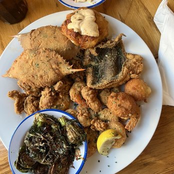 Hyman's Seafood - Fisherman's Feast Signature Platter with Cole slaw and bourbon glazed Brussels sprouts. - Seafood Near Me - Charleston, South Carolina