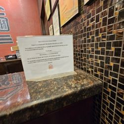 Lins Grand Buffet- Yuma - Notice of time limit, plus some awards on wall, permits, etc.