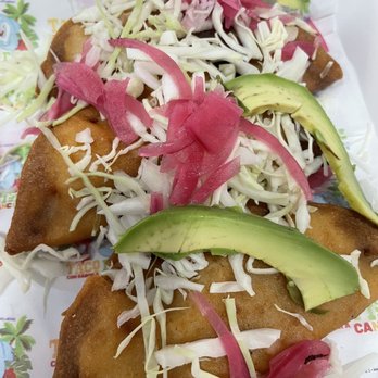 Taco Fish - a plate of fish topped with avocado and slaw - Seafood Near Me - Edinburg, Texas Taco Fish - a plate of fish topped with avocado and slaw - Seafood Near Me - Edinburg, Texas