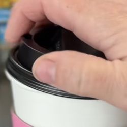 Cowgirl Barista - Poor hygiene, fingers touching mouth hole of lid.