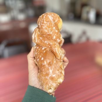 Donut Star - a person holding a doughnut in their hand - Donuts Near Me - San Diego, California Donut Star - a person holding a doughnut in their hand - Donuts Near Me - San Diego, California