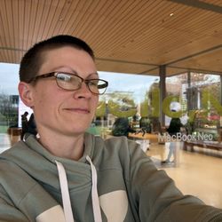 Apple University Village - Selfie with MacBook Neo window art on Tuesday 24 March 2026.