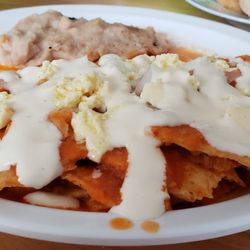 El Pasillo De Los Sabores - Chilaquiles con salsa rojo, onion, crema y frijoles! Homecooked taste.
