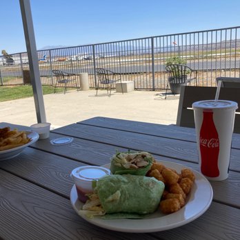 The Bombshelter - Chicken Cesar wrap and the run way outdoor seating - Sports Bars Near Me - Perris, California The Bombshelter - Chicken Cesar wrap and the run way outdoor seating - Sports Bars Near Me - Perris, California