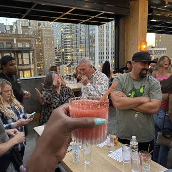 Booze Brothers Philly - a man holding up a drink - Tours Near Me Booze Brothers Philly - a man holding up a drink - Tours Near Me