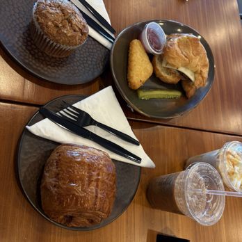 Happy Place Coffee & Eats - Chocolate croissant, sausage egg and cheese, morning glory muffin, carmel chai latte, and mocha frappe. - Cafes Near Me - Woodbridge, Virginia