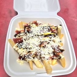 Carroll Fuel - Papitas locas, golden fries loaded with mayo, ketchup, salsa negra, and queso blanco