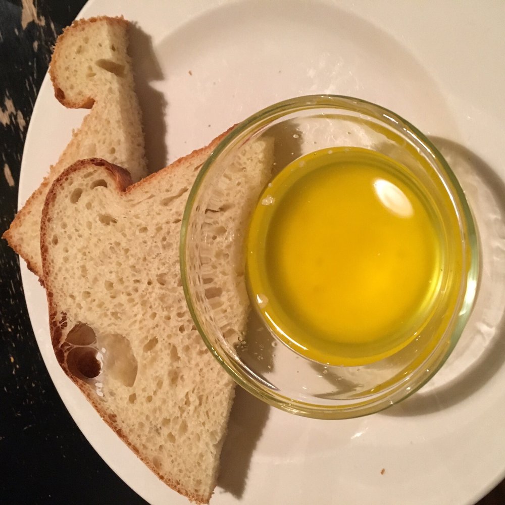 Roots Cafe - Fresh baked bread with melted butter - New American Near Me - Naples, New York Roots Cafe - Fresh baked bread with melted butter - New American Near Me - Naples, New York