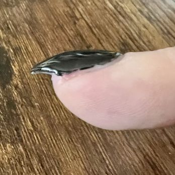 Daisy Nail Bar - Sloppy shape on bottom corner. - Hair Salons Near Me - Sacramento, California