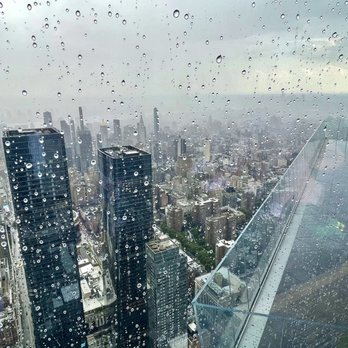 Peak with Priceless Restaurant & Bar - The Edge deck seen from rainy window - New American Near Me - New York, New York Peak with Priceless Restaurant & Bar - The Edge deck seen from rainy window - New American Near Me - New York, New York