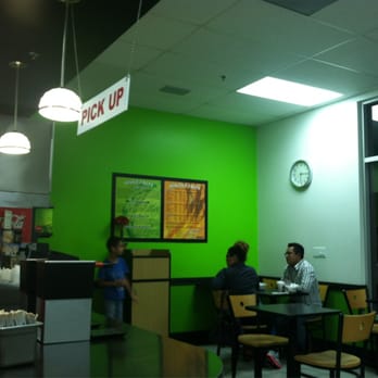 Flame Broiler - two people sitting at a table in a fast food restaurant - Fast Food Near Me - Santa Ana, California Flame Broiler - two people sitting at a table in a fast food restaurant - Fast Food Near Me - Santa Ana, California