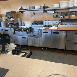 Waffle House - Waffle irons and prep area not clean.
