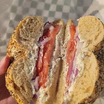 Leon’s Bagels - Everything bagel with garlic and herb cream cheese, tomato, and onion - Bagels Near Me - New York, New York